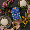 Kate McLeod Spring Awakening Body Stone Duo (2 pcs) - product shown on table with oranges and flowers. 