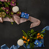 Kate McLeod Spring Awakening Body Stone Duo (2 pcs) - product shown on table with ribbon and flowers.