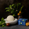 Kate McLeod Spring Awakening Body Stone Duo (2 pcs) - product shown next to oranges. 