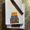 Carpe Diem Papers Vintage Trunks Le Petit Notepad (1 pc) - product shown on counter with pen. 