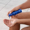 SONNI SunDay Body Balm SPF 40+ (85 ml) - product shown being applied to hand. 