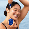 SONNI SunDay Mineral Serum SPF 50+ (50 ml) - product shown being applied to model's face. 