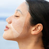 SONNI SunDown Restoration Electrolyte Sheet Mask (4 pcs) - product shown on model's face. 