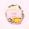 Superfine New York Meyer Lemon Poppyseed White Chocolate Bar (1.76 oz) - product shown on decorative tray. 