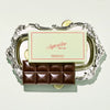 Superfine New York Salted Italian Olive Oil Dark Chocolate Bar (1.76 oz) - product shown in a decorative tray. 