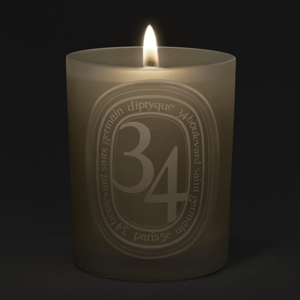 Diptyque 34 Boulevard Saint Germain Medium Candle (300 g) - product shown lit. 
