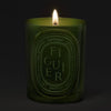 Diptyque Figuier (Fig) Medium Candle (300 g) - product shown lit.