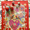 Avenida Home Nathalie Lete For Ever Tea Towel (1 pc) - product shown on a counter with eggs and tomatoes on top.