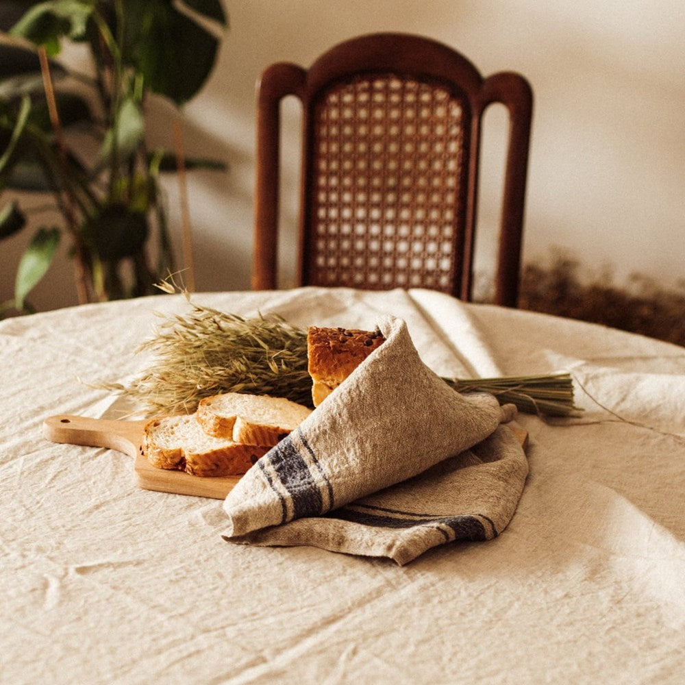 Linen Tales Linen Kitchen Towel - Vintage Blue Stripes (1 pc) - product shown on table. 