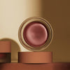 Minori Cream Blush - Orchid (4.9 g)  - product shown on tan background. 
