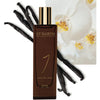 Lifestyle shot of Ligne St. Barth Vanille West Indies Parfum (1.7 oz) with vanilla pods and shot of white orchids in the background