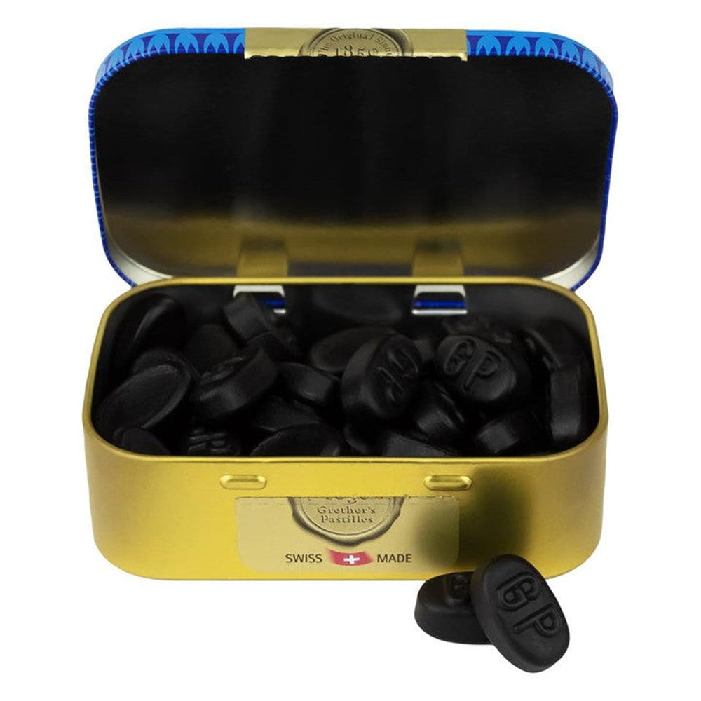 Grether’s Pastilles Blackcurrant Tin - Classic (110 g) shown open with pastilles inside and two in front of tin