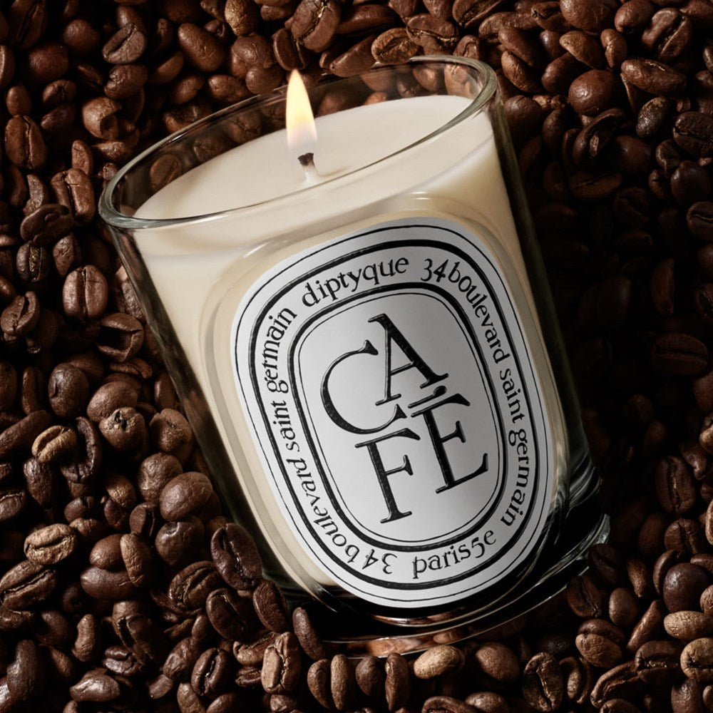 Diptyque Cafe Classic Candle (190 g) - product shown in coffee beans. 