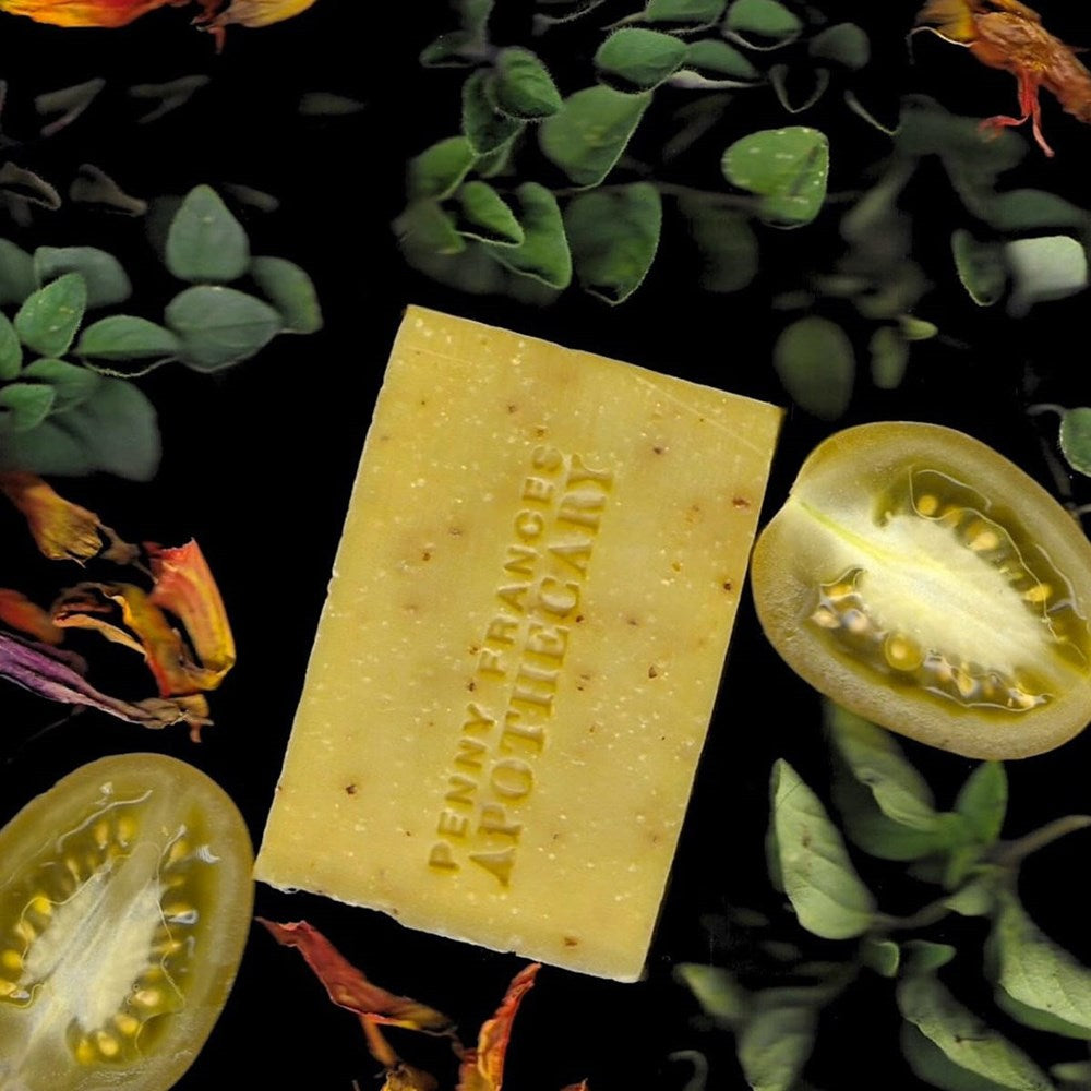 Penny Frances Apothecary Blood Orange & Tomato Seed Botanical Soap (142 g) - product shown with tomatos.