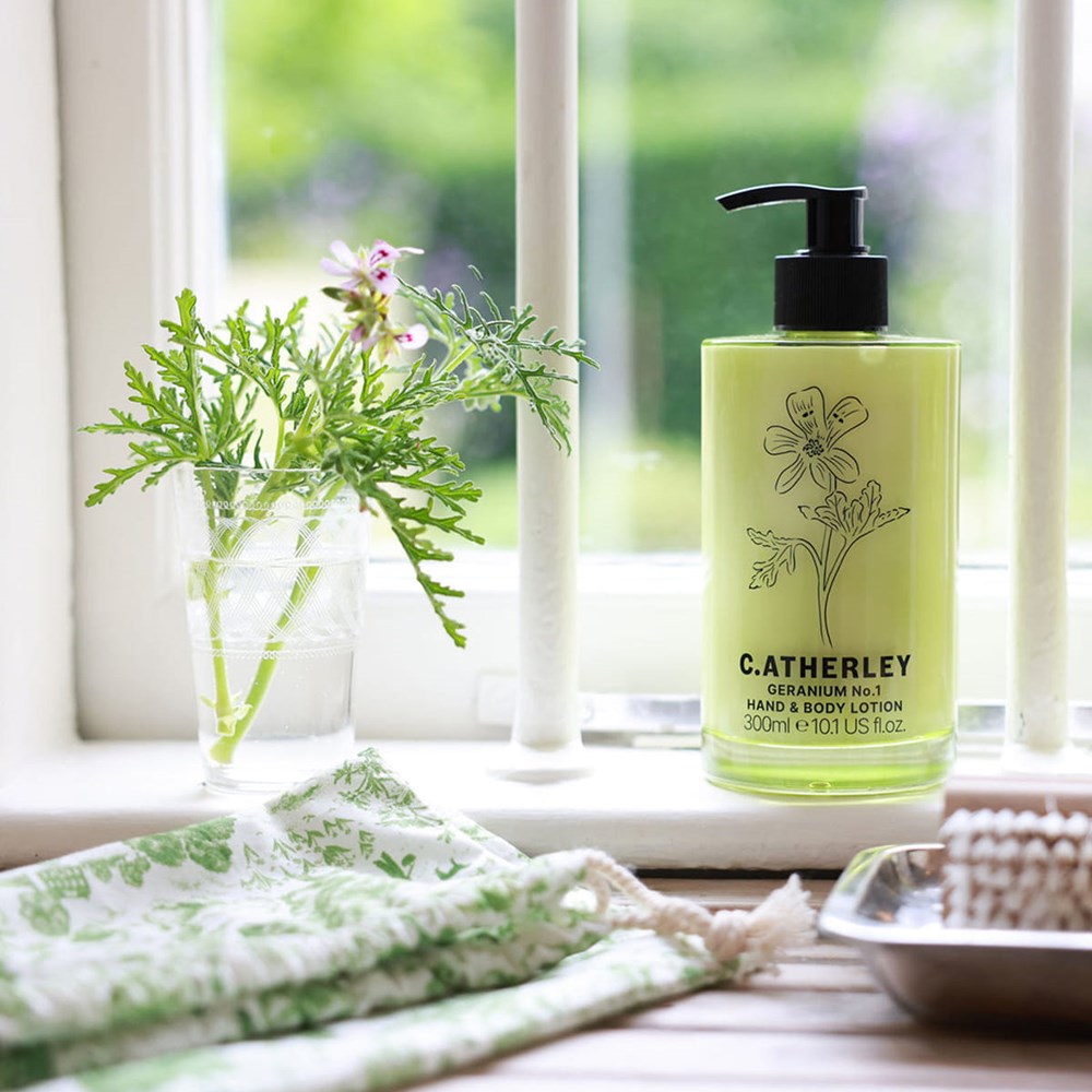 C.Atherley Geranium No.1 Hand & Body Lotion (30 ml) - product shown in a window sill. 