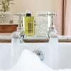 C.Atherley Geranium No.1 Bubble Bath (300 ml) - product shown on top of bathtub. 