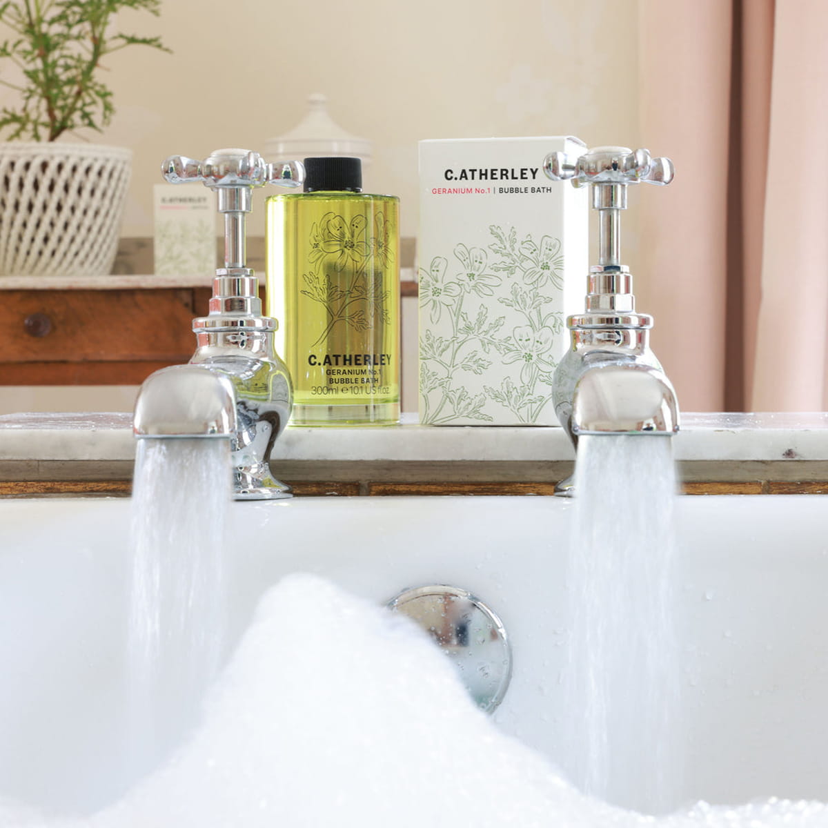 C.Atherley Geranium No.1 Bubble Bath (300 ml) - product shown on top of bathtub. 