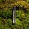 Heretic Parfum Dirty Hinoki Eau de Parfum (15 ml) - product shown on grass.