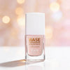 Kure Bazaar La Base Intensive Hyaluronique (10 ml) - product shown on white counter top with pink background.