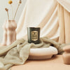 Floris London Grapefruit & Rosemary Scented Candle (1.75 ml) - product shown on green fabric. 