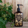 Botanopia Complete Organic Plant Food (450 ml) - product shown in front of plant. 