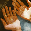 Flamingo Estate Organics Jasmine Damask Rose Glass Hand Soap (325 ml) - product shown on hands. 