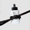 Cosmetics 27 Hair & Scalp Serum (50 ml) - product shown wrapped in hair. 