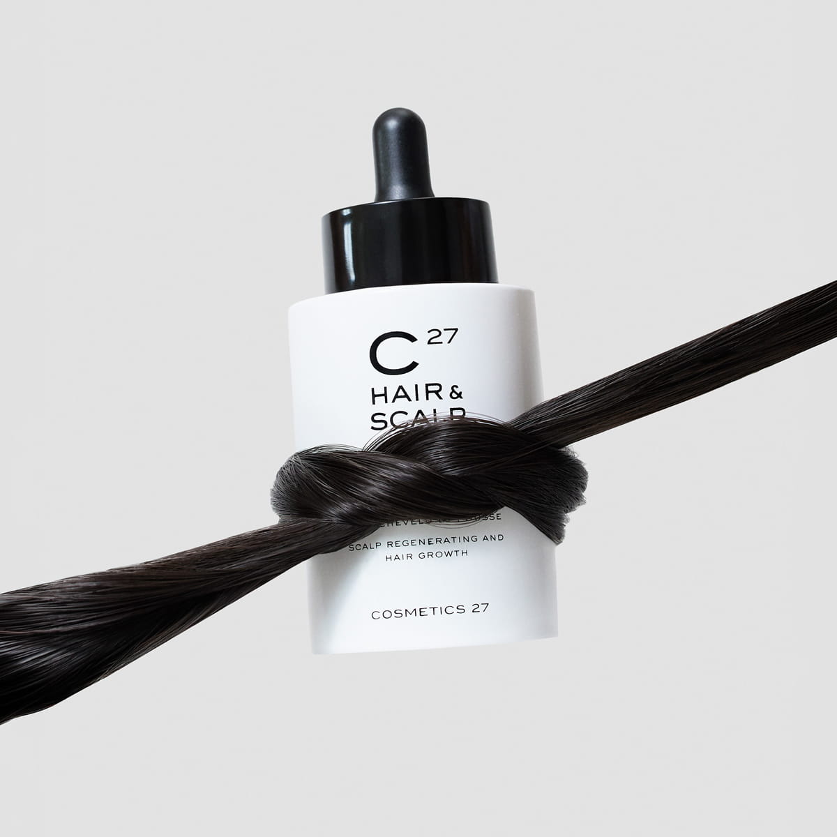 Cosmetics 27 Hair & Scalp Serum (50 ml) - product shown wrapped in hair. 