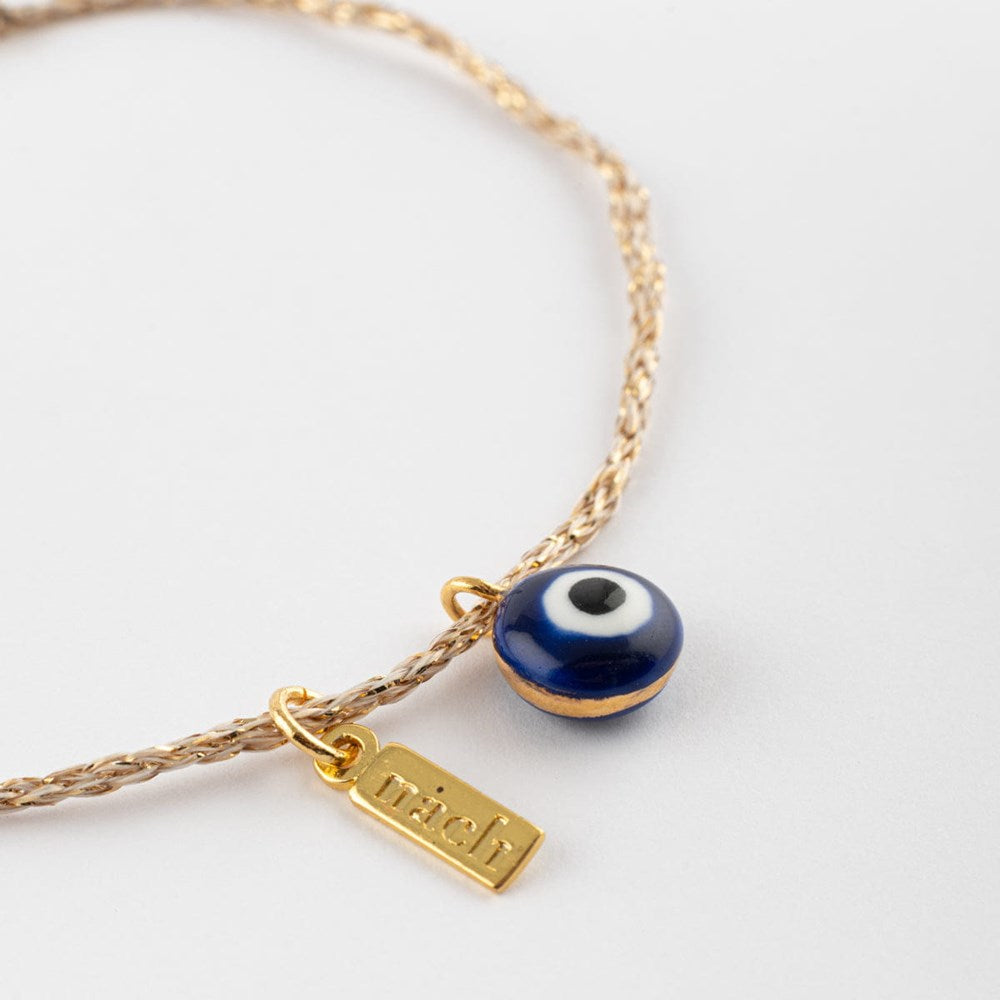 Nach Blue Eye Gold Rope Charm Bracelet (1 pc) - product shown laying on a white surface. 