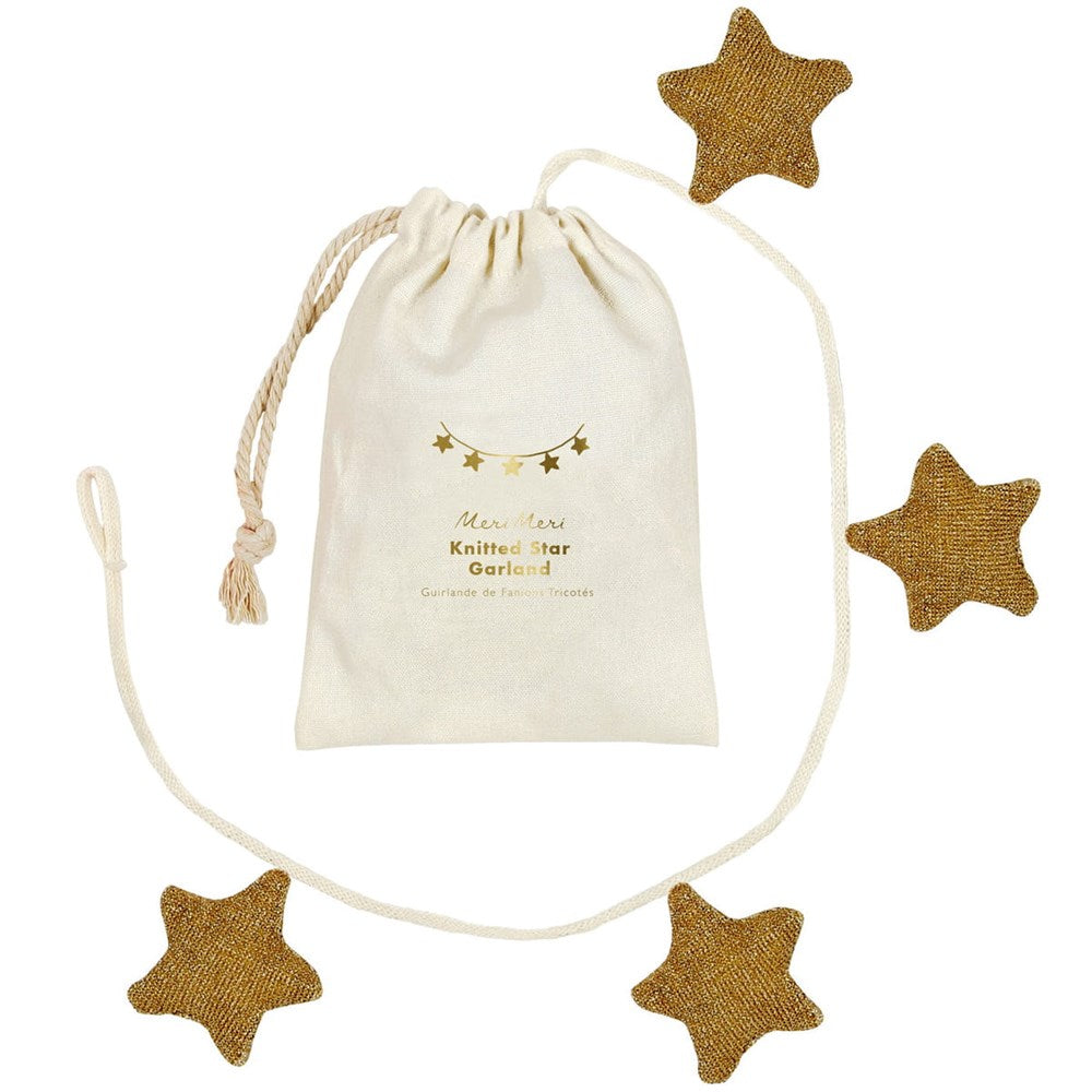Meri Meri Gold Knitted Star Garland (1 pc) - product shown coming out of packaging.
