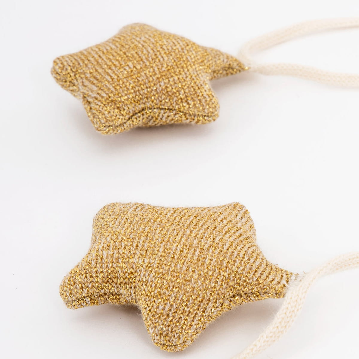 Meri Meri Gold Knitted Star Garland (1 pc) - product shown close up.