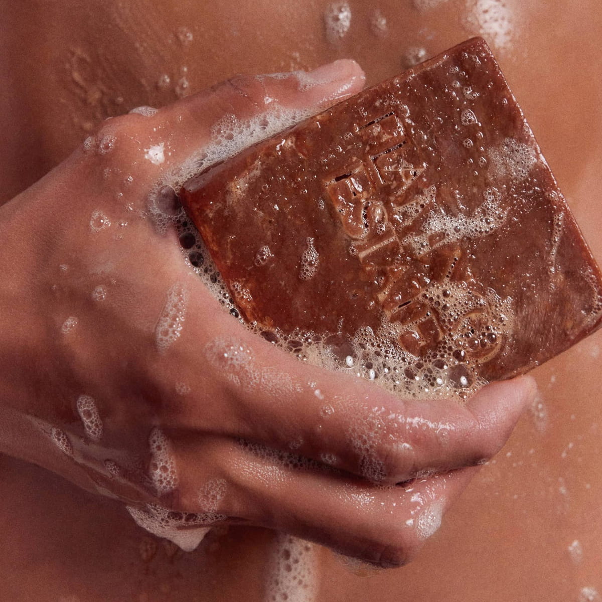 Flamingo Estate Heirloom Tomato Soap Brick (340 g) - product shown being lathered on skin. 