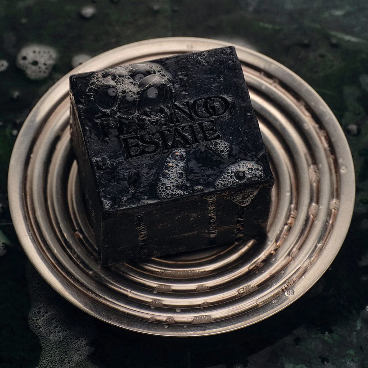 Flamingo Estate Lavender Activated Charcoal Soap Brick (340 g) - product shown on plate.