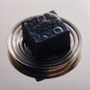 Flamingo Estate Lavender Activated Charcoal Soap Brick (340 g) - product shown on plate. 