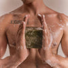 Flamingo Estate Rosemary Green Leaf Parsley Soap Brick (340 g) - product shown being lathered and held by model. 