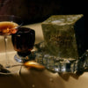Flamingo Estate Rosemary Green Leaf Parsley Soap Brick (340 g) - product shown on glass coaster next to wine. 