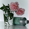 Flamingo Estate Jasmine Damask Rose Hand Soap (355 ml) - product shown next to roses. 