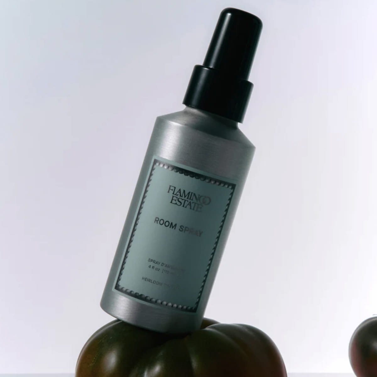 Flamingo Estate Heirloom Tomato Room Spray (118 ml) - product shown on top of tomatoes.