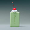 Flamingo Estate Prinsesstarta Milk Bar (141 g) - product shown with whipped cream and cherry. 