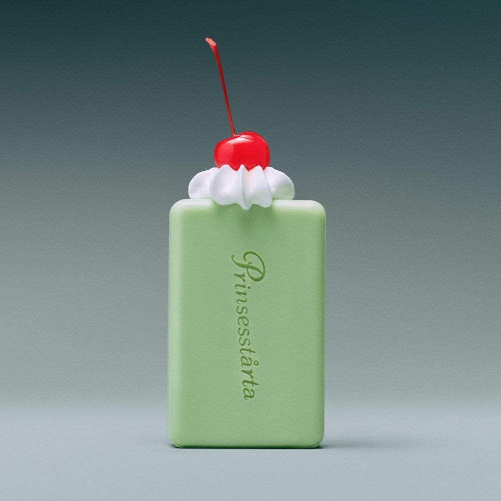 Flamingo Estate Prinsesstarta Milk Bar (141 g) - product shown with whipped cream and cherry. 