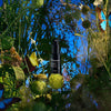 Heretic Parfum The Entomologist Insect Repellent Spray (50 ml) - product shown in leaves and blue background. 