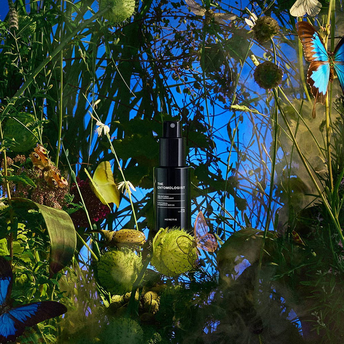 Heretic Parfum The Entomologist Insect Repellent Spray (50 ml) - product shown in leaves and blue background. 