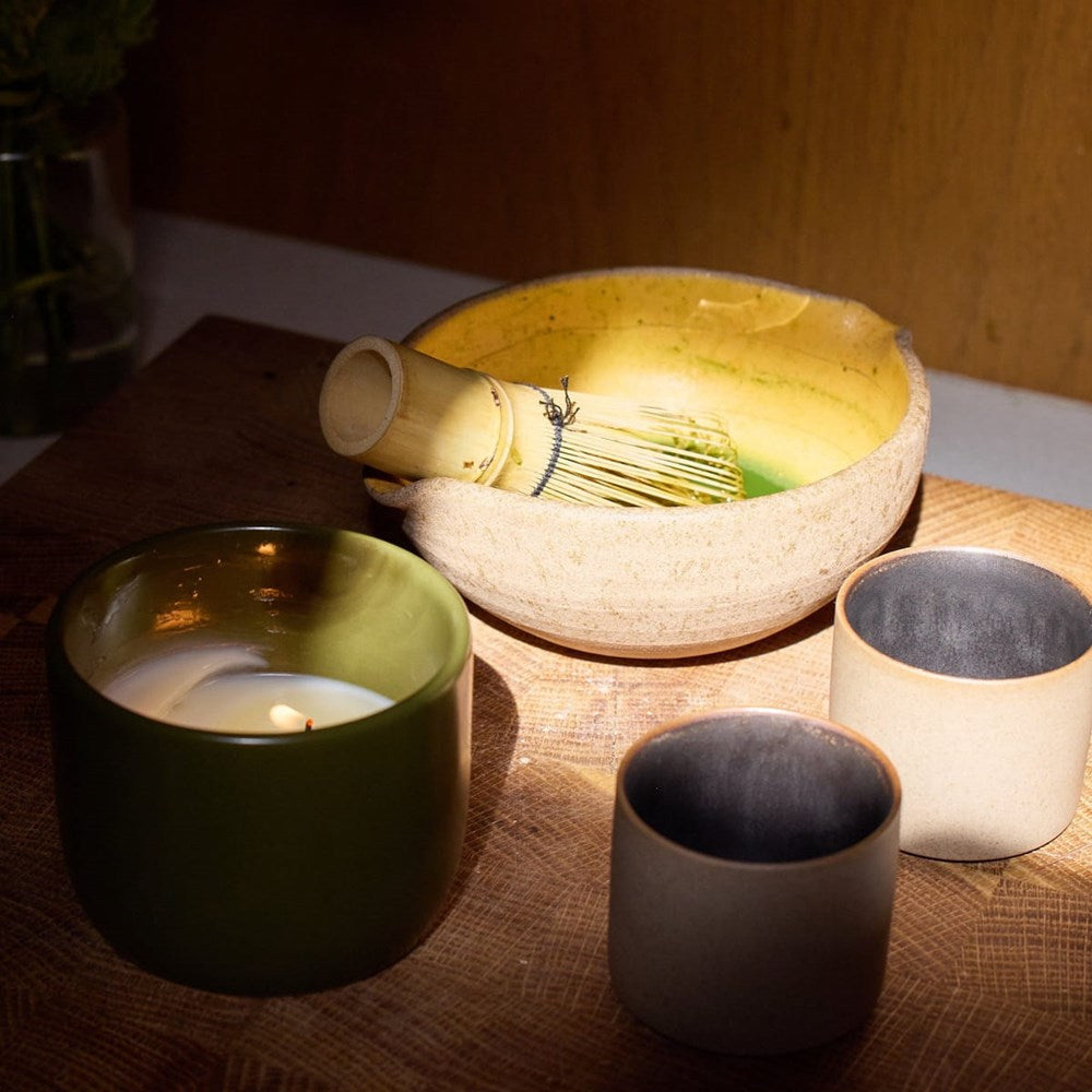 ROEN Candles Nakame Scented Candle (8 oz) - product shown next to cups and match bowl with whisk. 