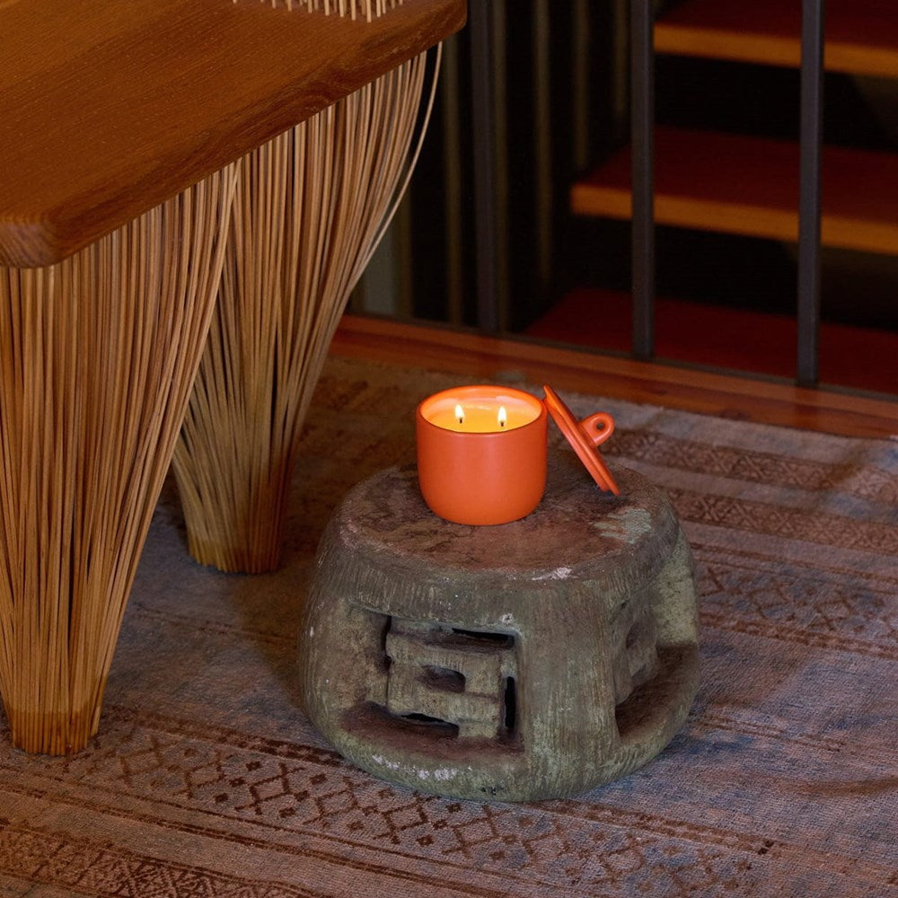 ROEN Candles Fushimi Scented Candle (8 oz) - product shown on wooden stool. 