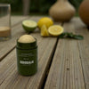 Sidebalm The Outside Balm (20 g) - product shown with citrus fruit in background. 