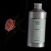 Flamingo Estate Jasmine Damask Rose Body Wash (355 ml) with a pink flower on a black background