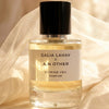 Lifestyle shot of A. N. OTHER x Galia Lahav Citrine Veil Parfum (50 ml) with white veil in the background
