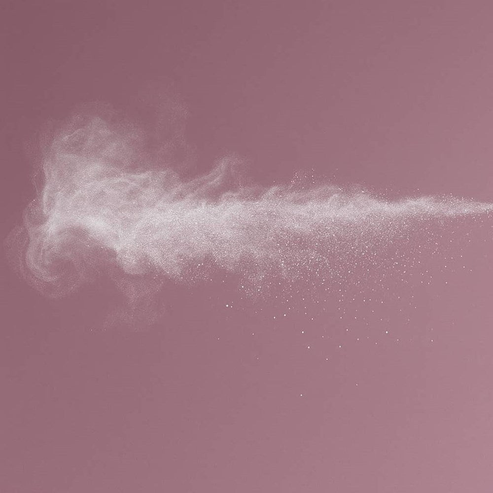 Cleo+Coco Body & Hair Powder - Lavender Vanilla (25 g) - product shown being sprayed. 