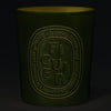 Diptyque Figuier (Fig) Large Candle (600 g) - product shown lit in dark room. 