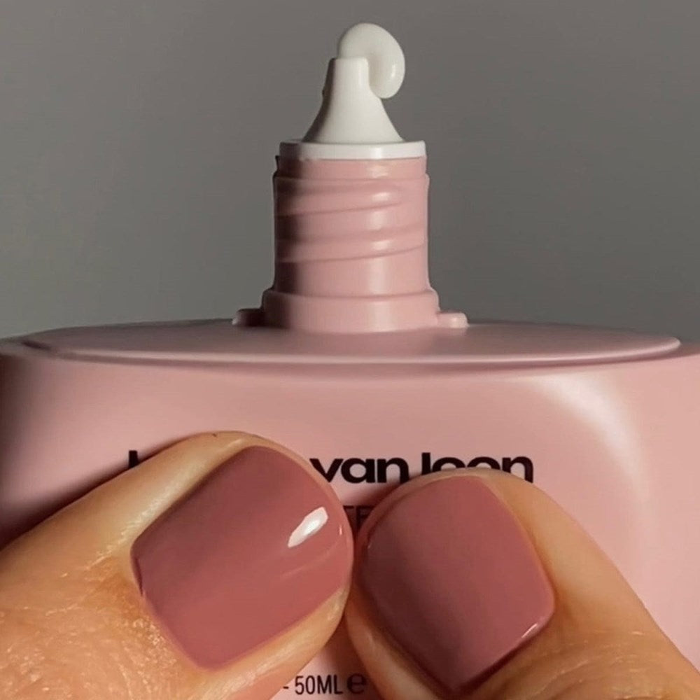 Karolin Van Loon Agate Hand Balm (50 ml) - product shown being squeezed with lid off. 